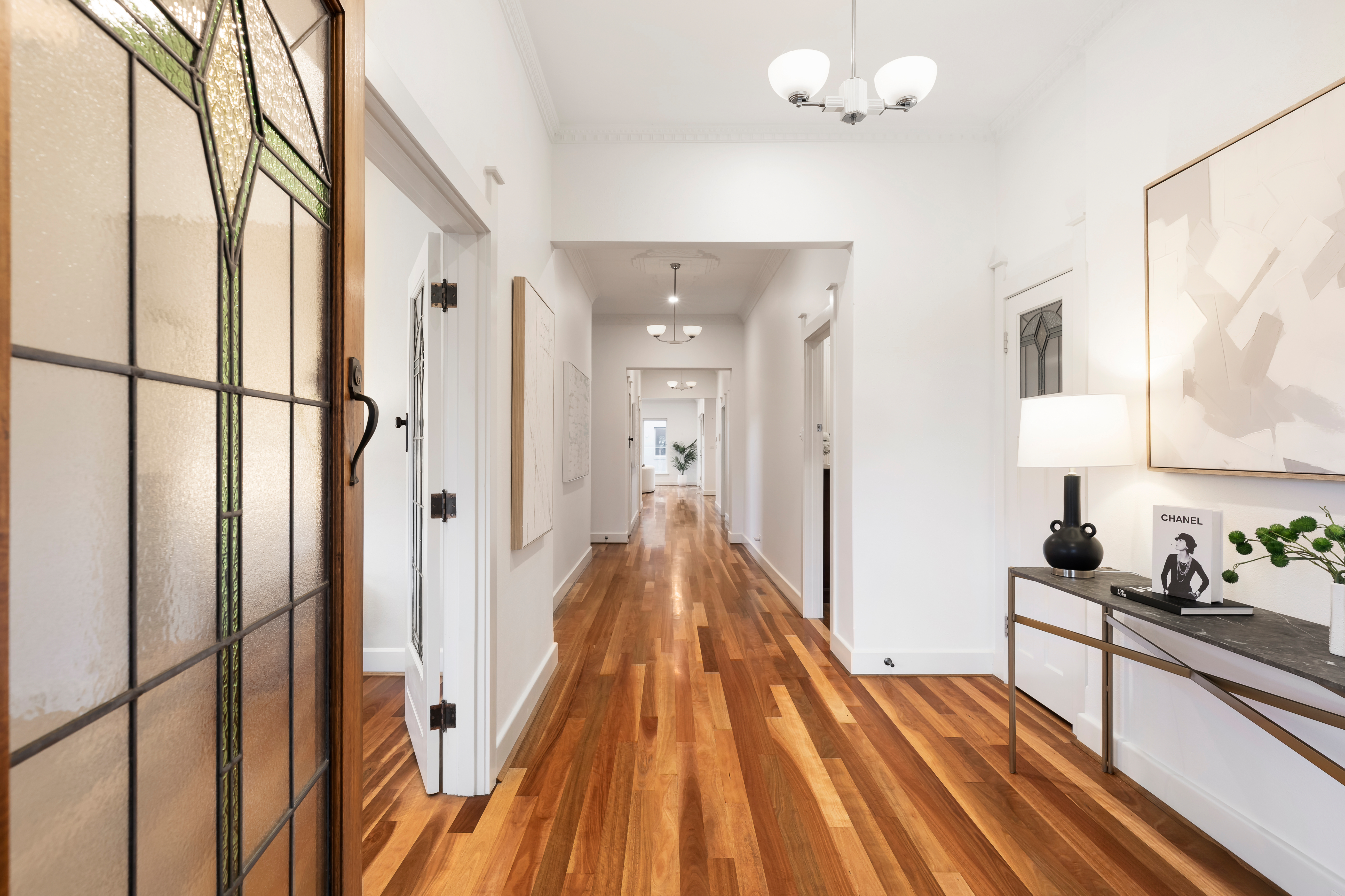 Styled period hallway with console and artwork